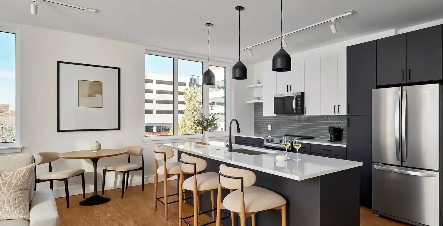 Modern kitchen with granite counter top and stainless steel appliances at AVE Normandy