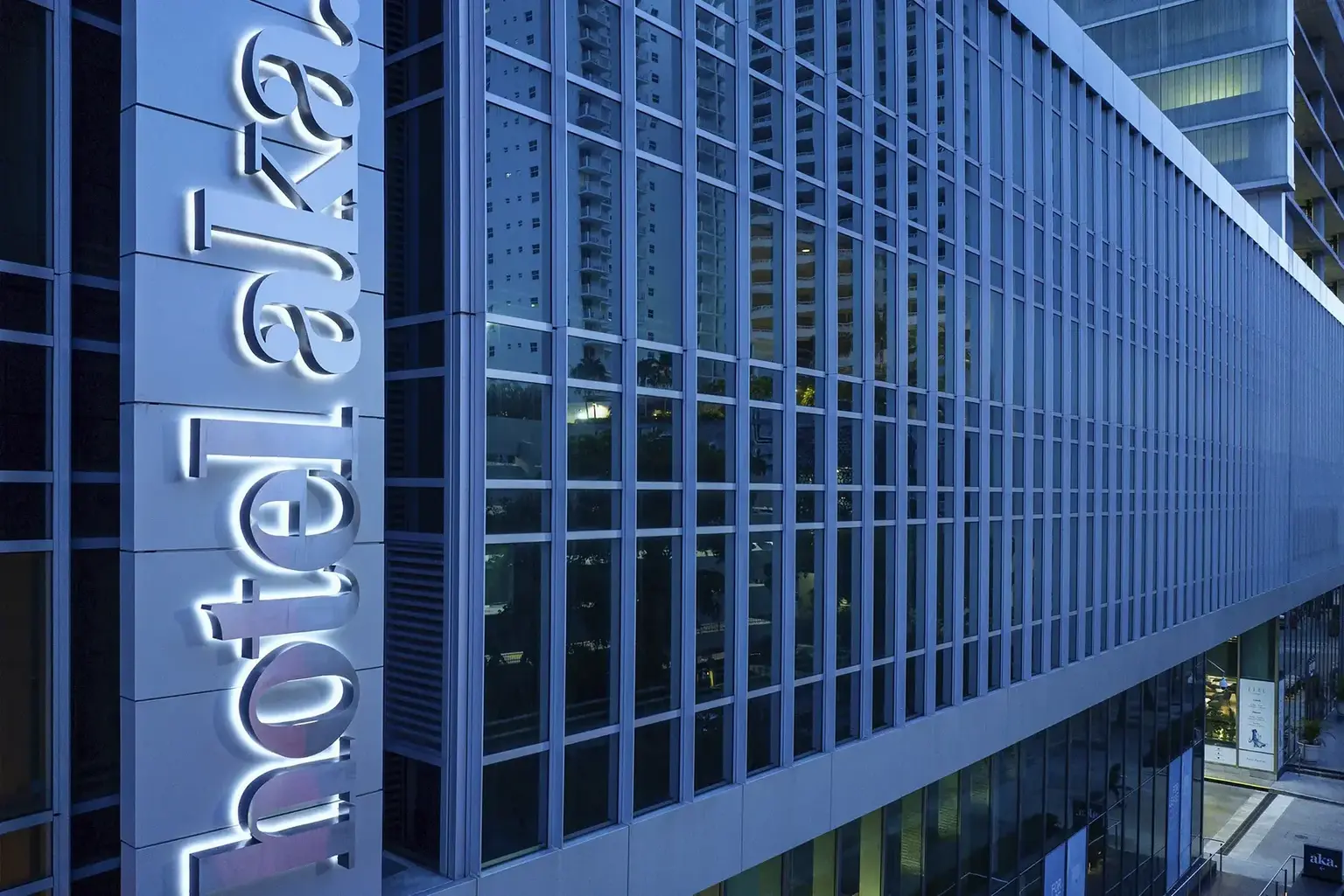 Hotel AKA Brickell exterior close up of the building showing Hotel AKA sign