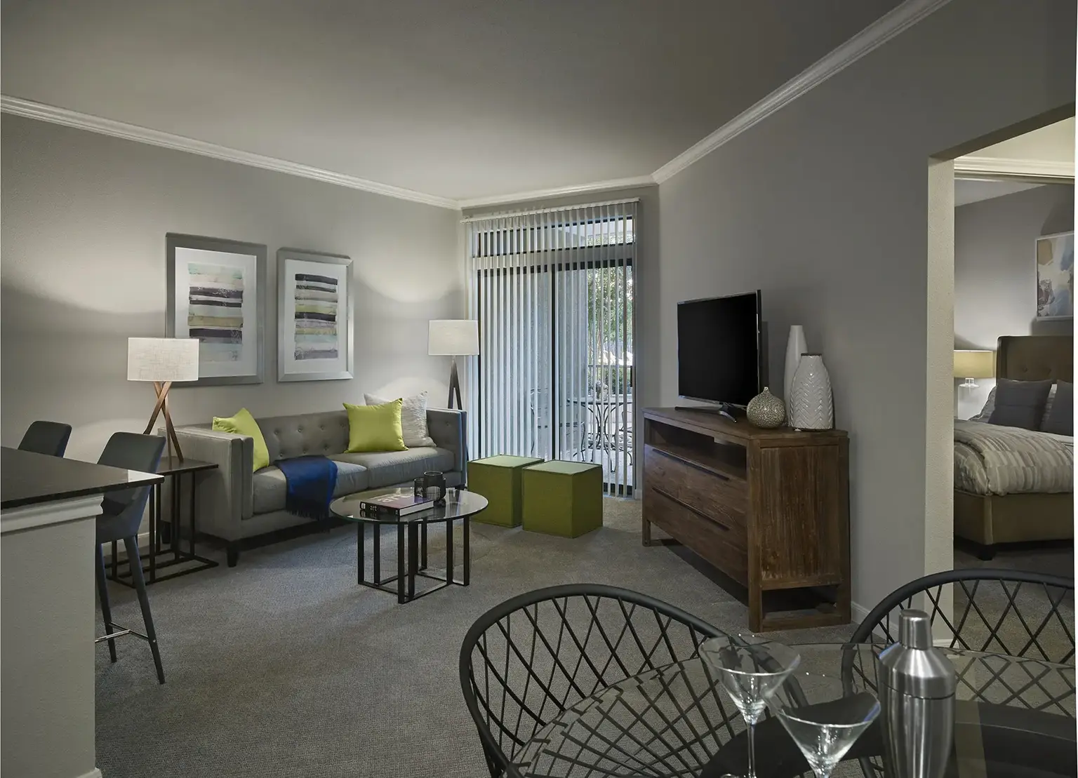AVE Clifton furnished apartment living room with gray couch and green pillows