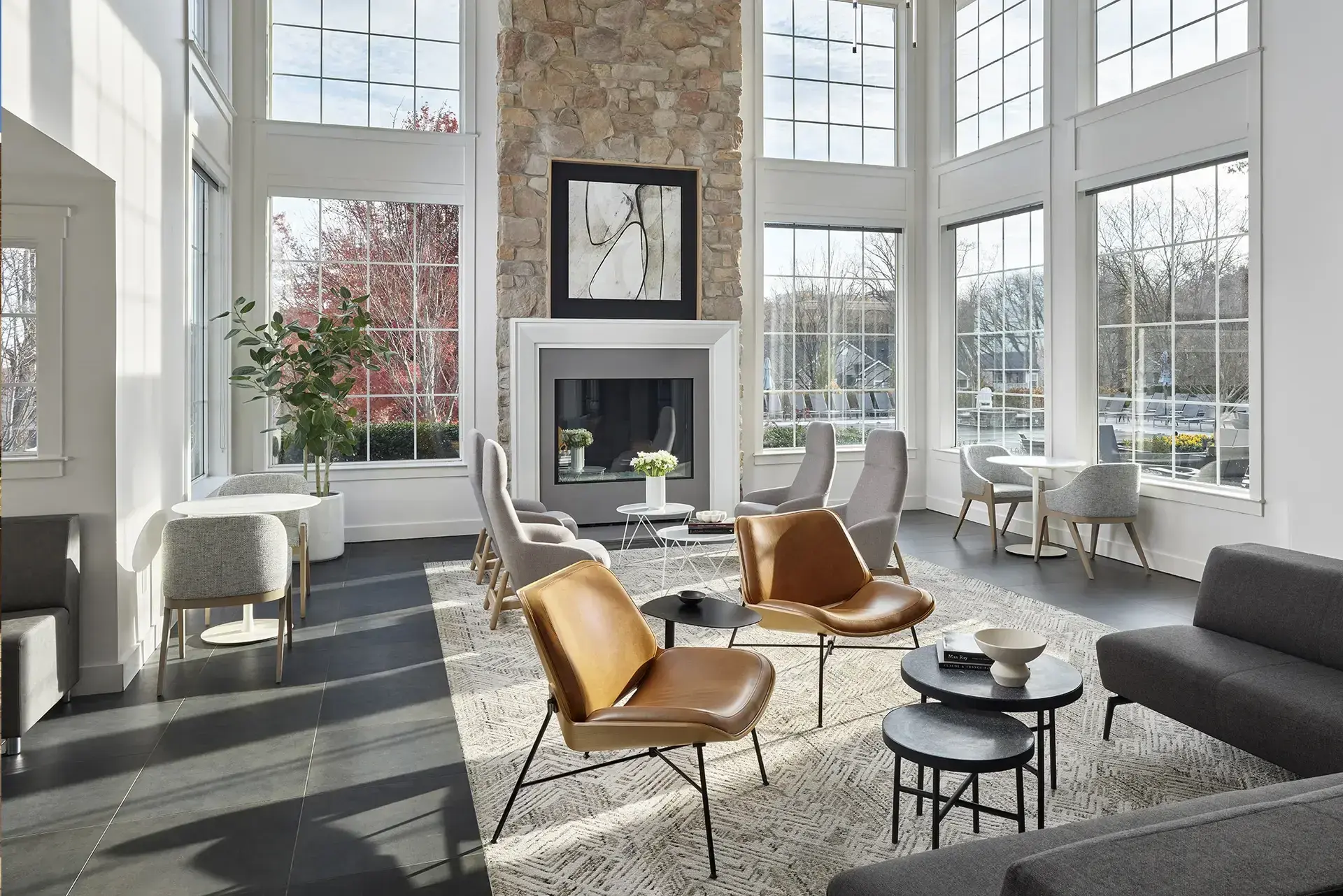 AVE Malvern lounge with fireplace and floor to ceiling windows