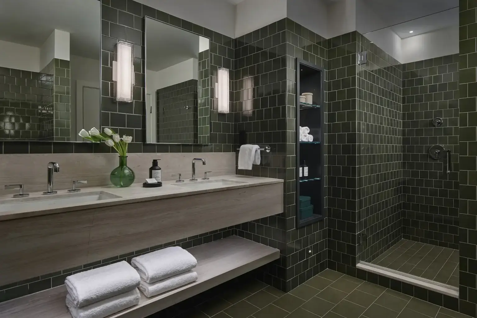Hotel AKA Back Bay rennovated bathroom with green subway tiles 