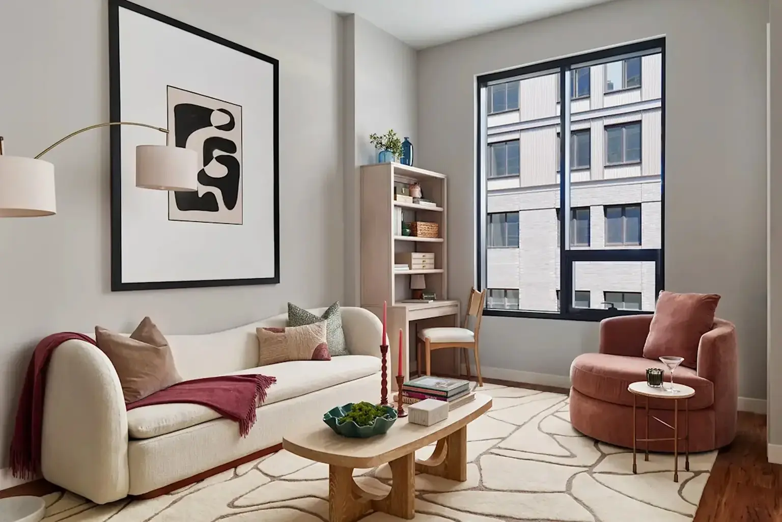 AVE Navy Yard Constitution Living Room with modern furnishings, large modern painting on the wall with a window