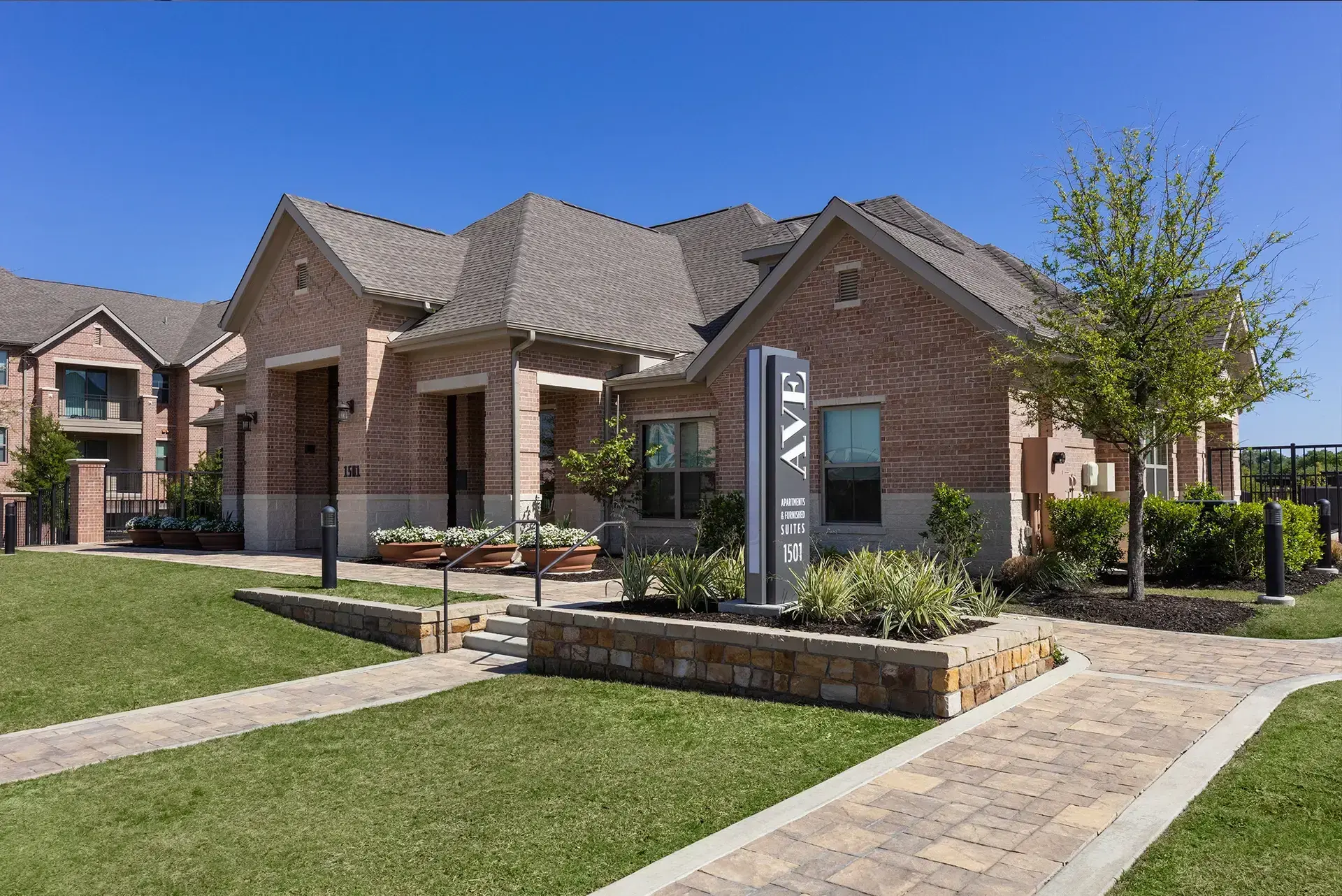 AVE Las Colinas main entrance with large AVE logo