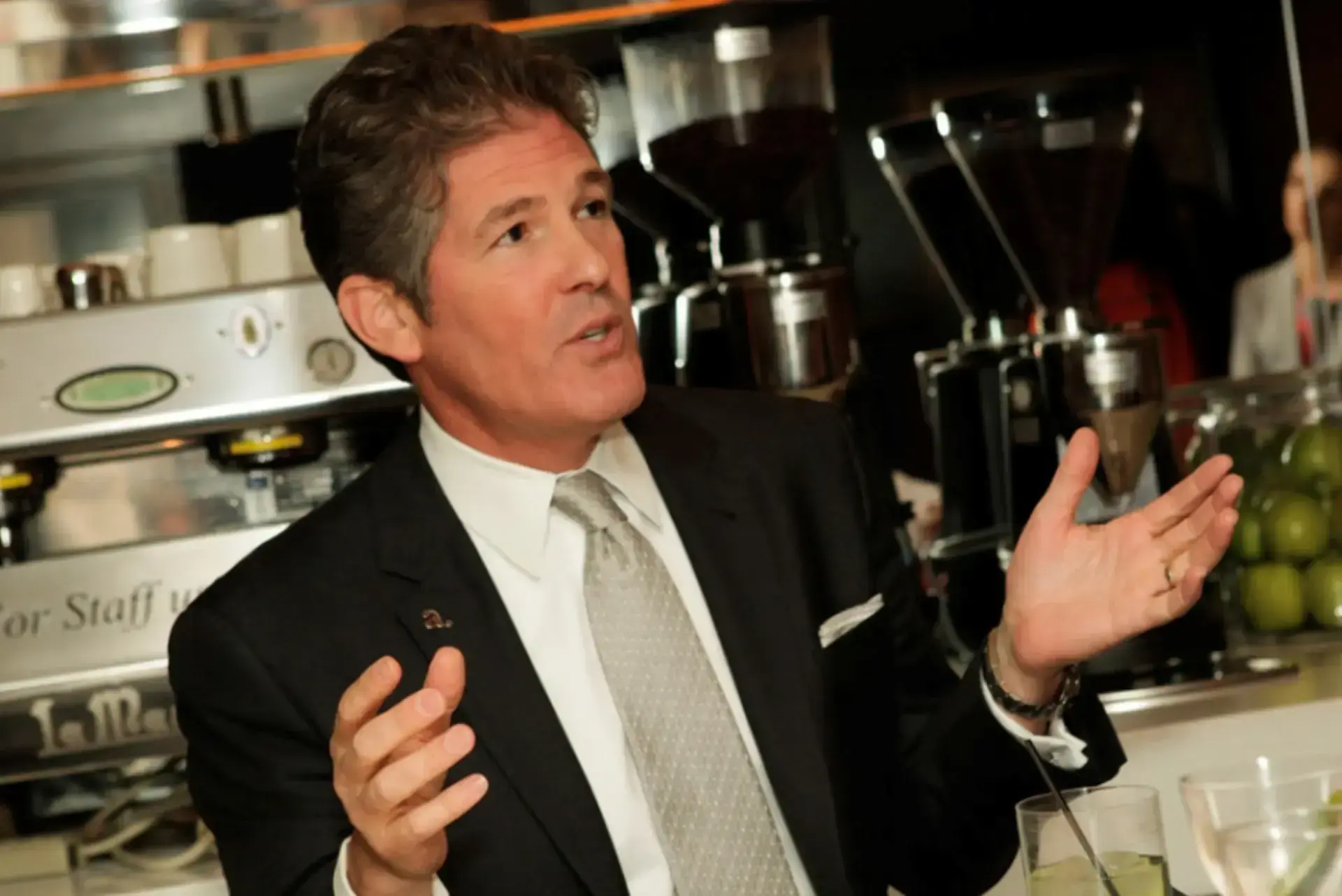 Photo of Larry Korman at a cafe having a conversation