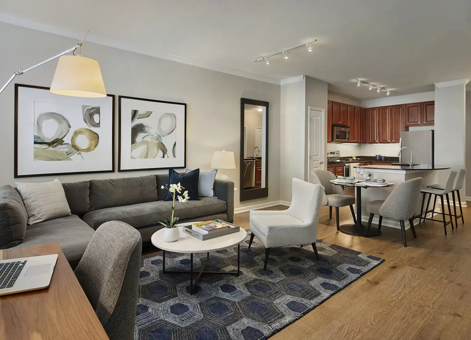AVE Union furnished apartment living room with warm floors, open kitchen, and living room furniture