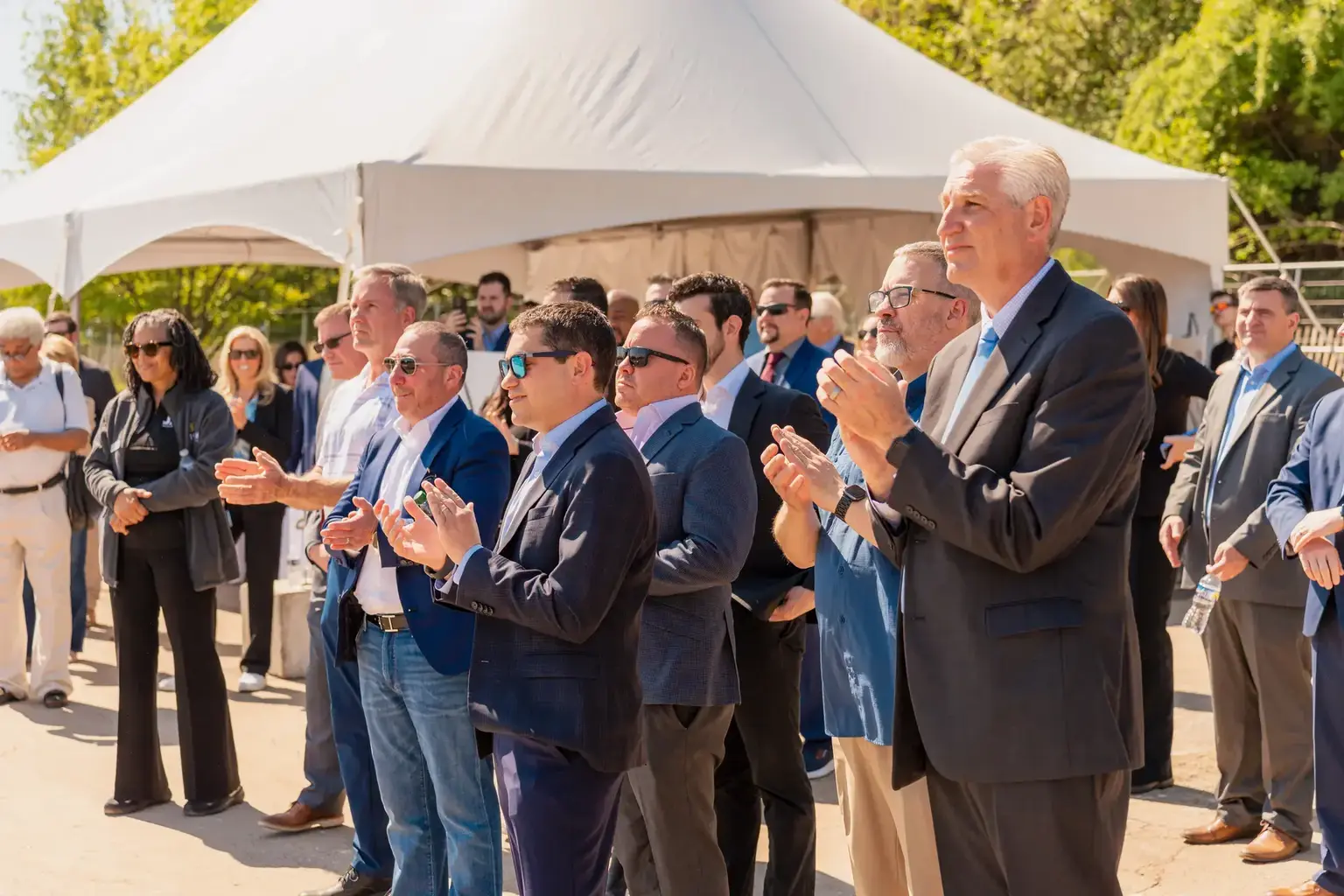 Guests applauding during the AVE Horsham groundbreaking ceremony
