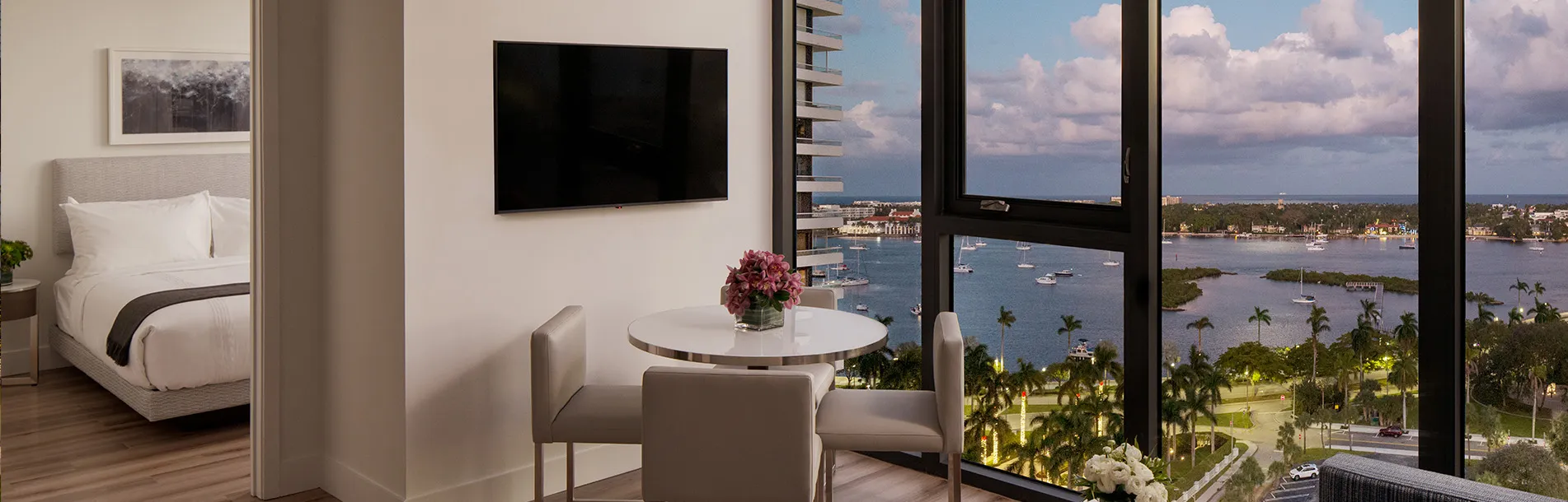 AKA West Palm apartment with large floor to ceiling window overlooking the bay